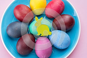 Colorful Easter eggs as an attribute of Easter celebration. Pink background