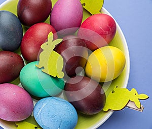 Colorful Easter eggs as an attribute of Easter celebration. Pink background