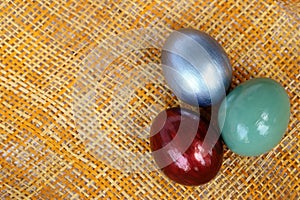 Colorful easter eggs on bamboo weave sheet background,