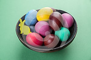 Colorful Easter eggs in bowl. Attribute of Easter celebration