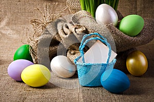 Colorful easter eggs on burlap