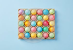 Colorful Easter Eggs Carton on Blue Background