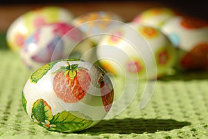 Colorful Easter eggs on country table on green tablecloth. Background and texture.Easter symbol. Spring festive concept.