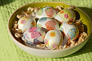 Colorful Easter eggs on country table on green tablecloth. Background and texture.Easter symbol. Spring festive concept.