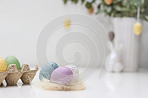 Colorful easter eggs decoration on white table