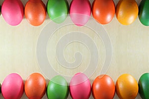 Colorful easter eggs double edge border on marble background with copyspace.