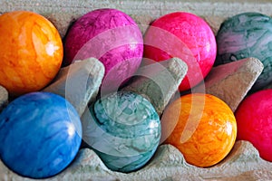 Colorful Easter Eggs in an egg carton