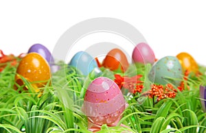 Colorful Easter Eggs On Green Grass.