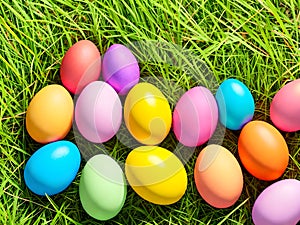 Colorful Easter eggs on green grass background with copyspacee. Generative AI