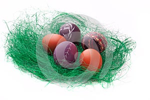 Colorful Easter Eggs in a green grass nest