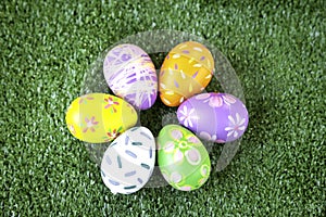 Colorful Easter eggs on green grass at the yard   festival and holiday spring coming  Easter calibration