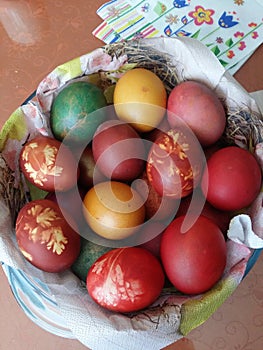 Colorful Easter eggs in a knit basket