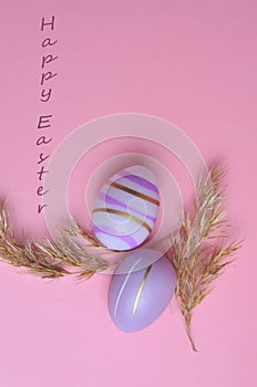 Colorful Easter eggs on a pink background