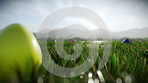 Colorful Easter eggs scattered on a green meadow, fly over