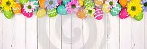 Colorful Easter eggs and spring flowers top border against a white wood banner background