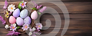 Colorful Easter Eggs and Spring Flowers on Wooden Background