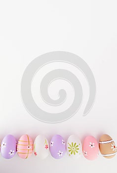 Colorful Easter eggs on white background with space for message
