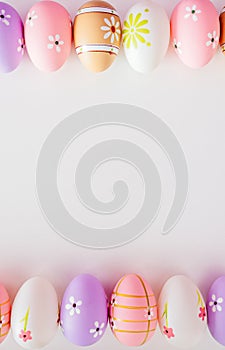 Colorful Easter eggs on white background with space for message