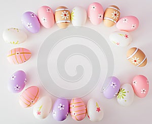 Colorful Easter eggs on white background with space for message