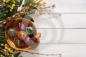 Colorful easter eggs on white wood background
