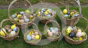 Colorful Easter Eggs in Wicker Baskets on Grass