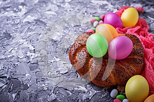 Colorful Easter eggs and wicker bread