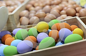 Colorful Easter eggs in the wooden box in blur background