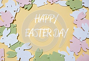 colorful easter rabbits on a pastel yellow background.