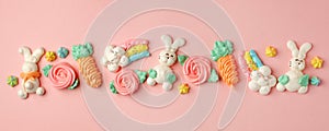 Colorful easter Sweet cookies, meringue on pink background, colorful seasonal holiday concept, stylish greeting card, invitation,