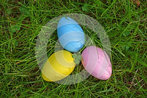 Colorful eggs on fresh springtime grass