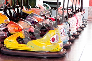 Colorful electric bumper car in autodrom in the fairground attractions at amusement park