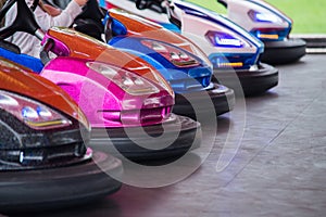 Colorful electric bumper car in autodrom in the fairground attractions at amusement park