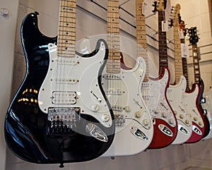 Electric Guitars hanging in a row