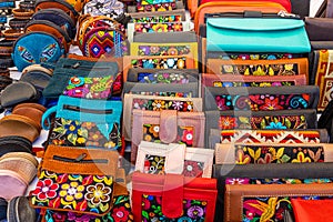 Colorful embroidered decorative textile and leather wallets. Ecuador