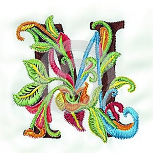 A colorful embroidered letter m on a white background, embroidery on white background