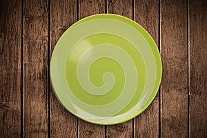 Colorful empty plate on grungy background table