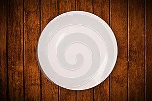 Colorful empty plate on grungy background table