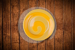 Colorful empty plate on grungy background table