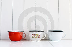 Colorful enameled mugs