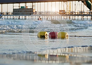 Colorful enclosing buoys on the sea