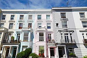 Colorful English houses facades in London, blue sky