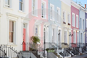 Colorful English houses facades, pastel pale colors