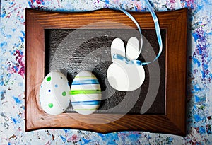 Colorful Ester eggs in a photo frame