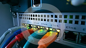 Colorful ethernet cables connected to network switch, symbolizing high speed data transfer, secure communication, and modern