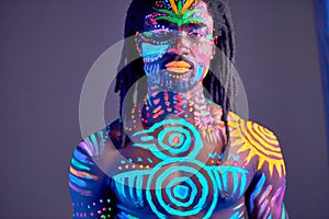 Colorful ethnic fluorescent prints on man`s body