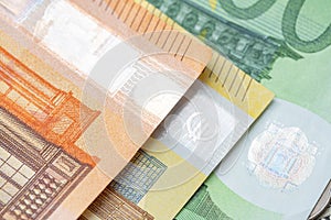 Colorful Euro Banknote, Orange fifty Euro, Yellow 200 Euro and green one hundred Euro bills. Closeup of Euro Bills. Hologram