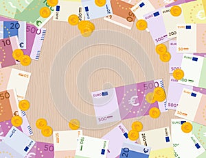 Colorful euro banknotes and euro coins on a wood background.