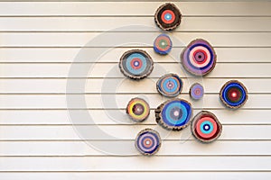 Colorful evil eyes Nazar boncugu on the cream wall photo