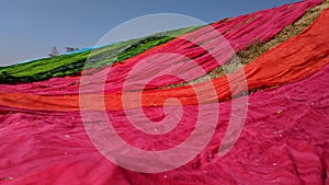 Colorful fabric drying after traditional dye process