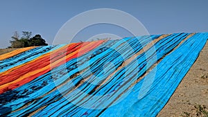 Colorful fabric drying after traditional dye process